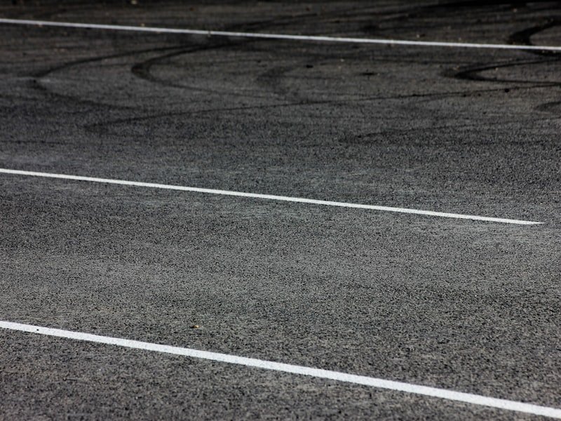 Freshly line-marked asphalt parking lot surface